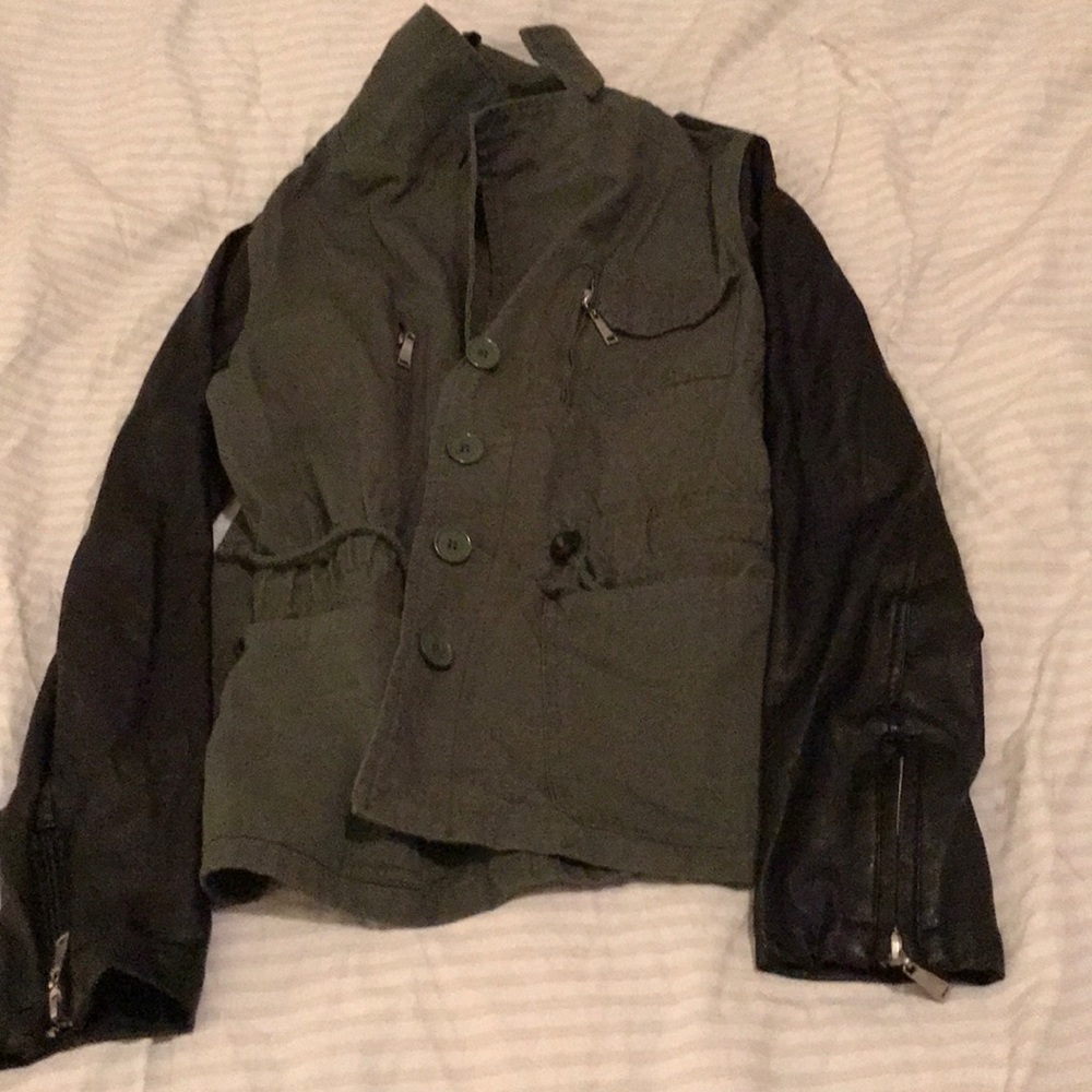 A olive green jacket that is military style.
